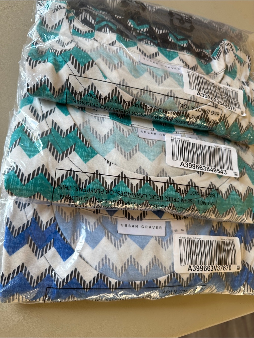 Susan Graver Top, Teal in L & XL, Aqua & Blue in M with bow ties on sleeve cuffs
